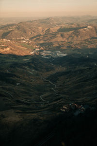 High angle view of snowcapped mountains against sky