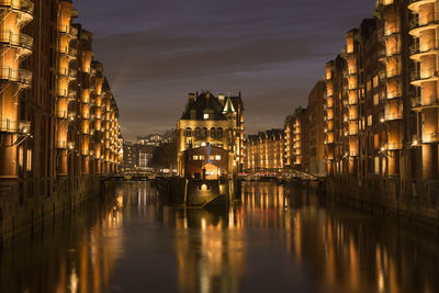 Illuminated buildings in water