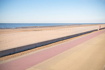 Scenic view of beach against clear sky