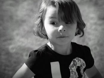 Close-up of cute girl looking away in playground