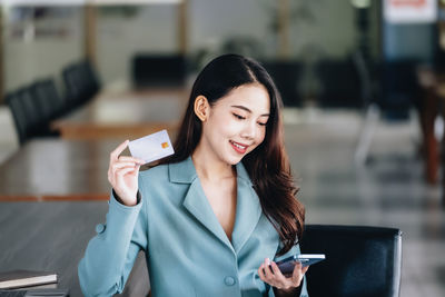 Young woman using mobile phone