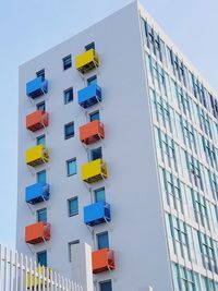 Low angle view of buildings against clear blue sky