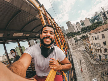 Young men on santa teresa tram ride - rio de janeiro - brazil