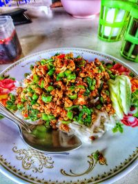 High angle view of vegetables in plate on table