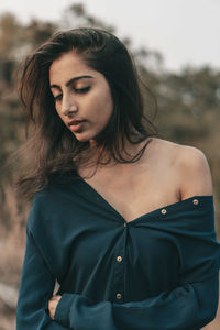 Young woman standing outdoors