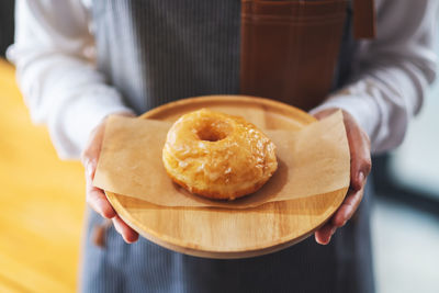 Midsection of person holding food