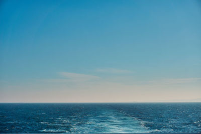 Scenic view of sea against blue sky