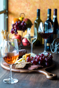 Red, white and rose wine with a charcuterie board of fine meats and cheese.