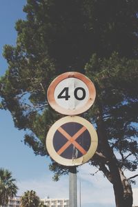Road sign against clear sky