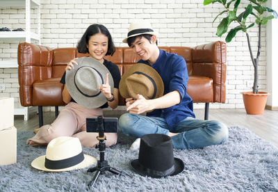 Happy friends sitting on seat