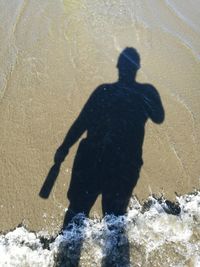 Shadow of man on beach