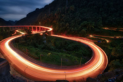 High angle view of light trails on road at night