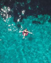 High angle view of woman swimming in pool