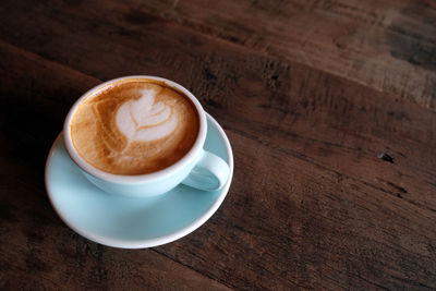 High angle view of cappuccino on table