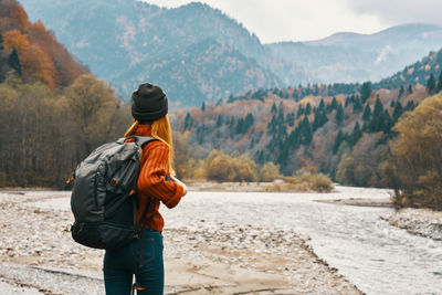 Rear view of man standing on mountain