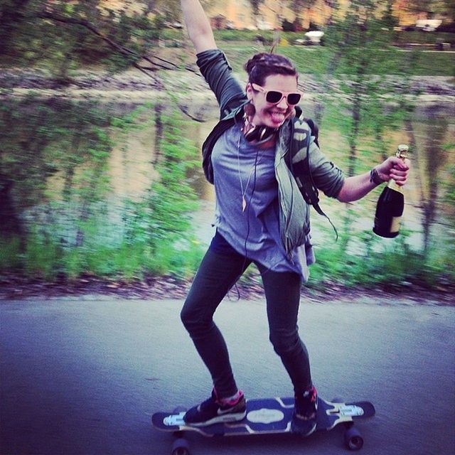 lifestyles, full length, leisure activity, casual clothing, person, young adult, transportation, mode of transport, front view, tree, holding, childhood, young men, skateboard, sitting, standing, outdoors, day