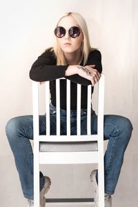 Portrait of woman sitting on chair