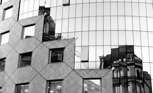 Low angle view of statue in city against sky