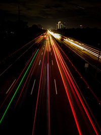 High angle view of light trails on highway at night