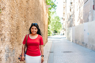 Portrait of smiling young woman outdoors