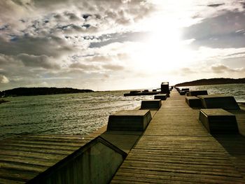 Pier over sea against sky