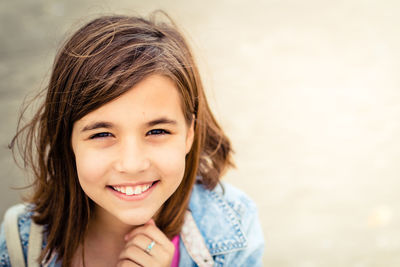 Portrait of smiling girl with brown hair