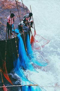 High angle view of people on boat in sea