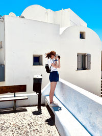 Rear view of woman walking on street