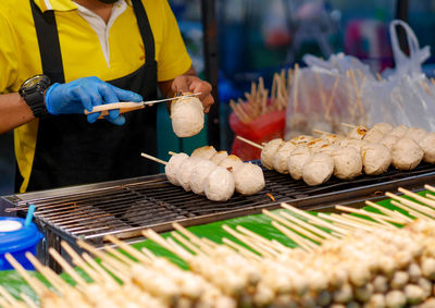 Midsection of man preparing food