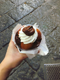 Midsection of person holding ice cream cone