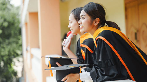 Side view of a smiling young woman