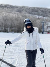 Woman with umbrella on snow