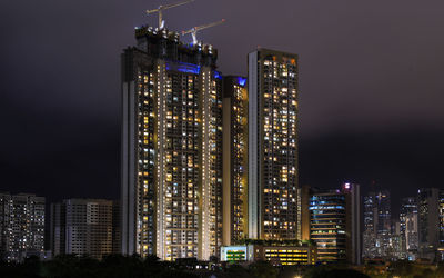 Illuminated buildings in city at night