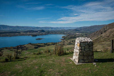 Scenic view of landscape and mountains against sky