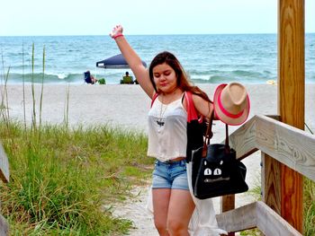 Woman standing on beach