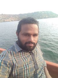 Portrait of young man in sea