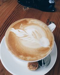 High angle view of cappuccino on table