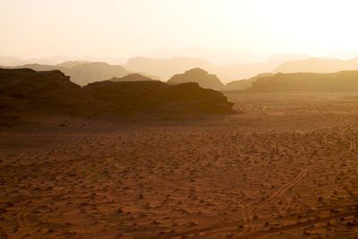 Scenic view of landscape against sky during sunset