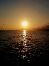 Scenic view of sea against clear sky during sunset
