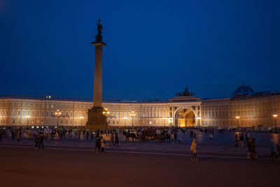 Group of people in front of building at night