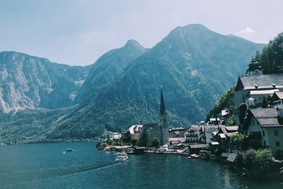 Panoramic view of lake and buildings against sky