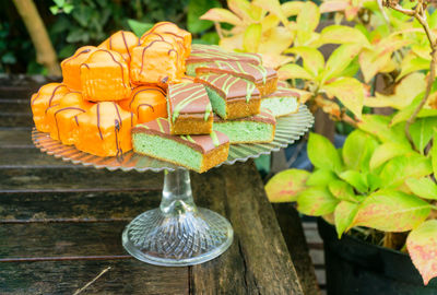 Close-up of dessert on cakestand at table