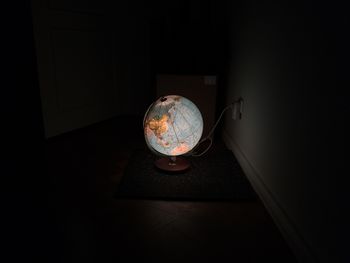 High angle view of illuminated globe at home
