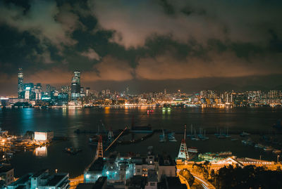 Aerial view of city lit up at night