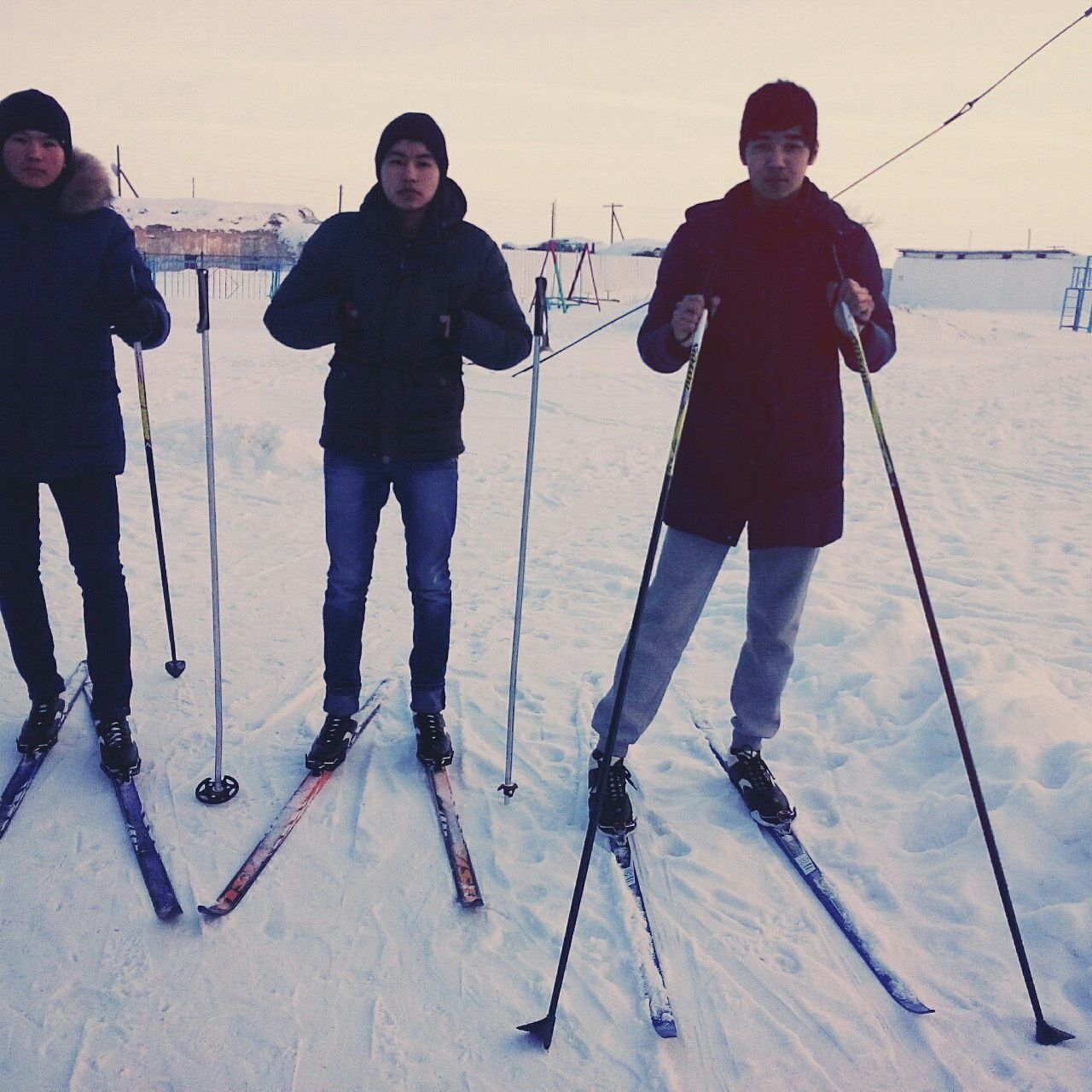 lifestyles, leisure activity, casual clothing, full length, standing, young adult, person, young men, togetherness, front view, warm clothing, men, looking at camera, smiling, day, bonding