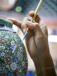 Close-up of person holding hand