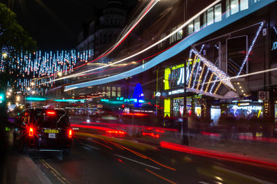 Illuminated city street at night