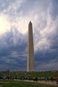 Low angle view of historical building against cloudy sky