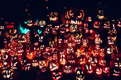 Low angle view of illuminated lanterns at night