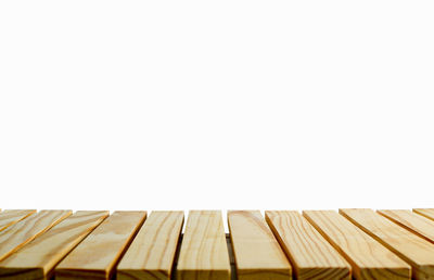 Close-up of wooden planks against white background